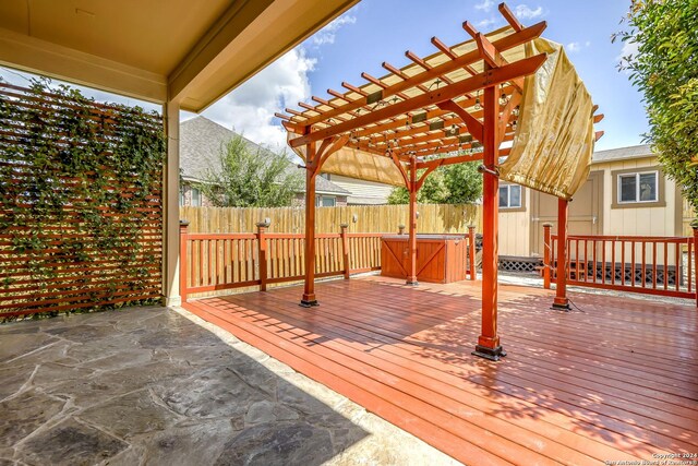 wooden terrace featuring a patio area and a pergola