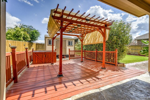 wooden deck featuring a pergola