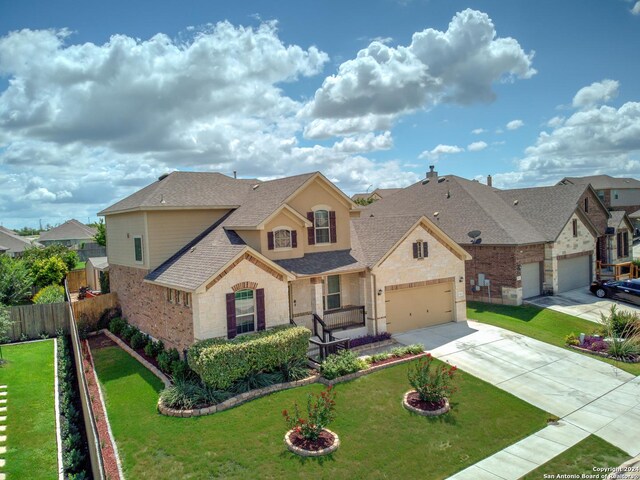 view of front facade with a garage and a front yard