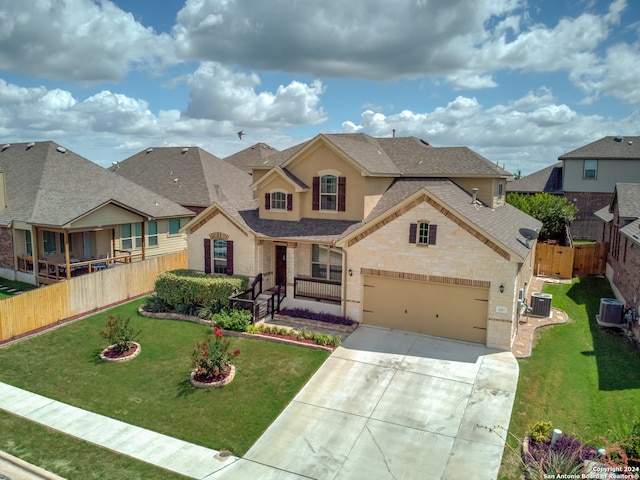 view of front of home featuring a garage, a front lawn, and cooling unit