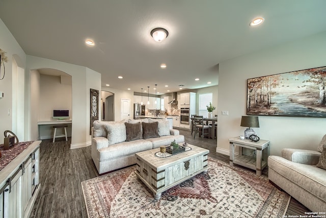 living room with dark hardwood / wood-style floors