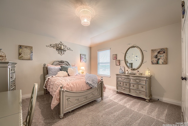 bedroom with carpet and an inviting chandelier