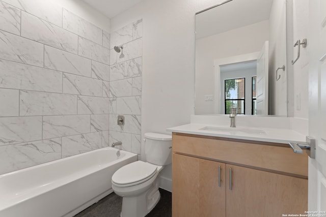 bathroom with toilet, vanity, and shower / bathtub combination