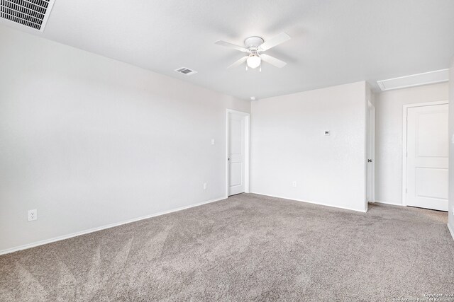 unfurnished room featuring ceiling fan and carpet floors