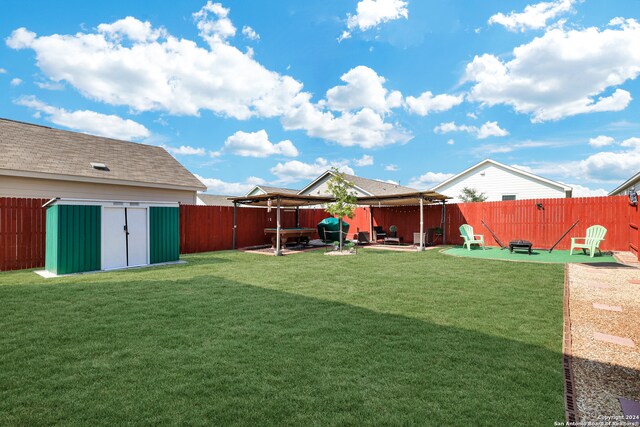 view of yard with a patio area and a storage shed