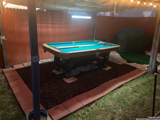 recreation room with wooden walls and billiards