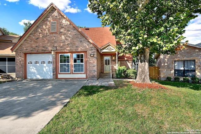 view of front of house with a front yard and a garage