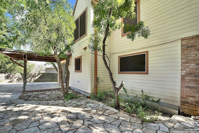 view of property exterior featuring a patio