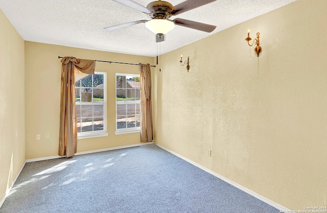 unfurnished room featuring ceiling fan, a textured ceiling, and carpet flooring