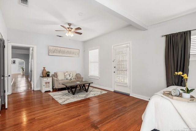 bedroom with ceiling fan, hardwood / wood-style flooring, access to outside, and beamed ceiling