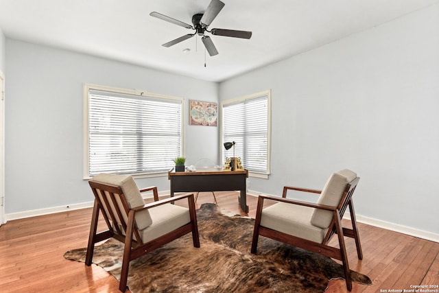 office space with ceiling fan and light hardwood / wood-style floors