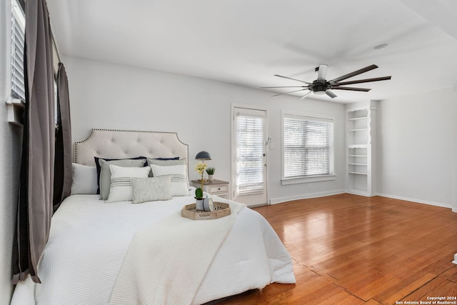 bedroom with ceiling fan and wood-type flooring