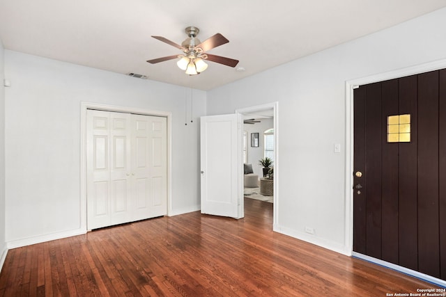 foyer entrance featuring ceiling fan and dark hardwood / wood-style flooring