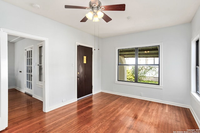 spare room featuring hardwood / wood-style flooring and ceiling fan