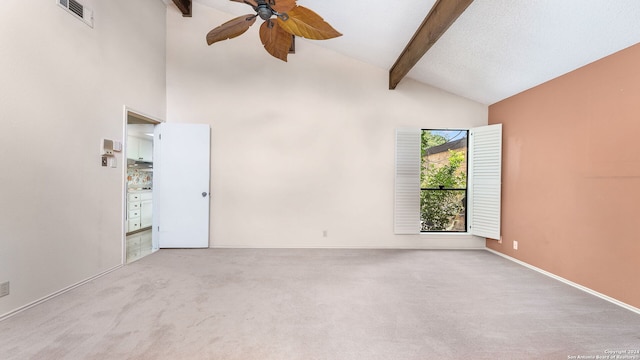 unfurnished room featuring light colored carpet, ceiling fan, beamed ceiling, and high vaulted ceiling