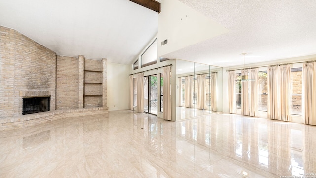 unfurnished living room featuring high vaulted ceiling, a fireplace, and a textured ceiling