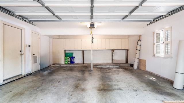 garage with a garage door opener and water heater