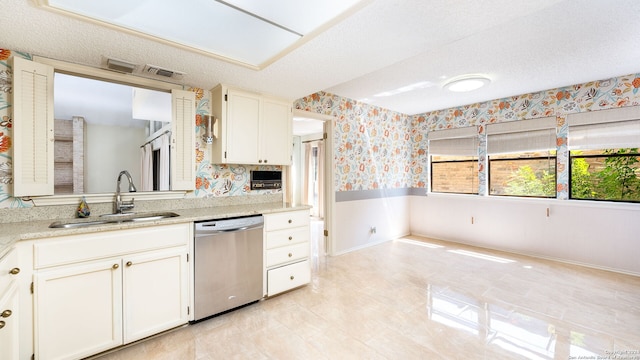 kitchen featuring white cabinets, dishwasher, a textured ceiling, and sink