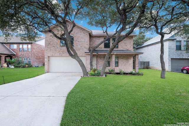 view of front facade with a garage and a front yard