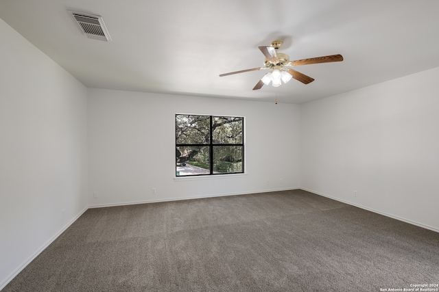 spare room with carpet flooring and ceiling fan