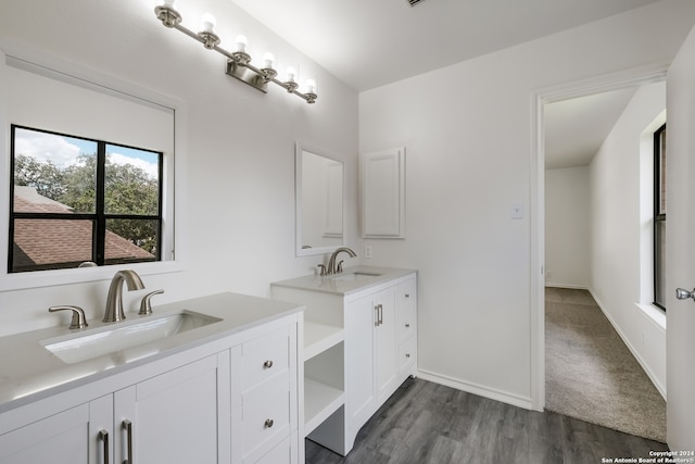 bathroom with vanity and hardwood / wood-style floors