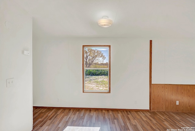 spare room with light hardwood / wood-style floors