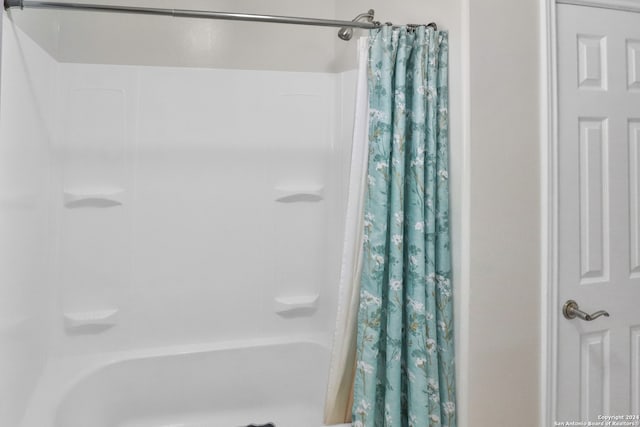 bathroom featuring shower / bath combination with curtain