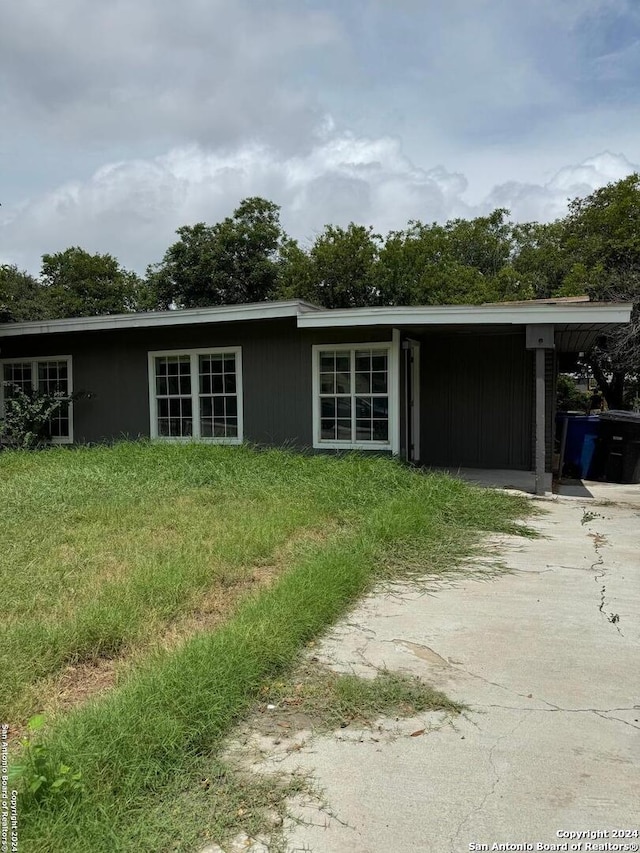 exterior space with a carport