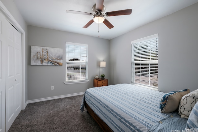 carpeted bedroom featuring ceiling fan and a closet