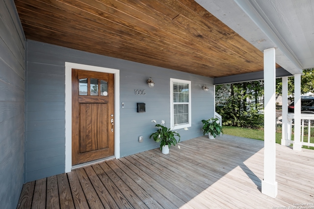 wooden terrace featuring covered porch