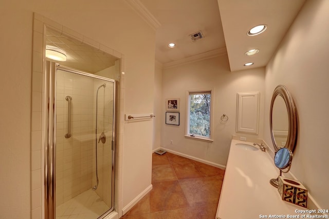 bathroom with crown molding, vanity, and walk in shower