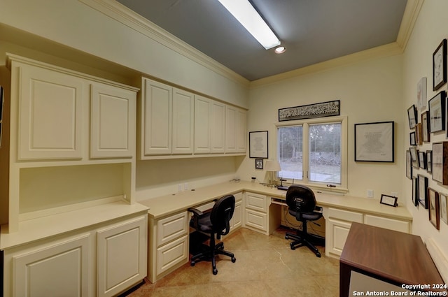 tiled office featuring built in desk and ornamental molding