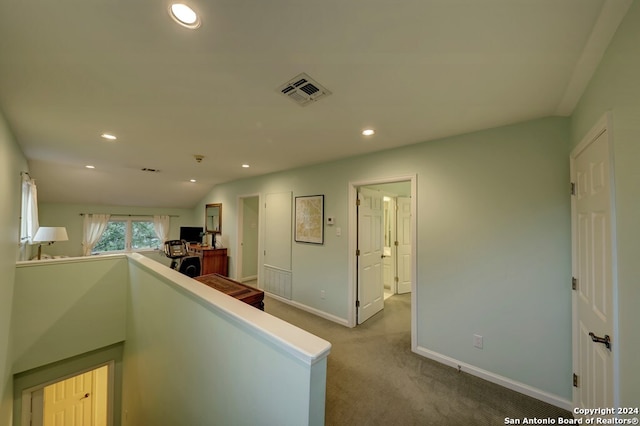 corridor with carpet flooring