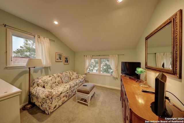 living room featuring lofted ceiling and carpet floors