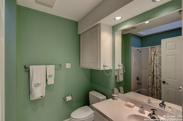 bathroom with vanity, toilet, and a shower with shower curtain