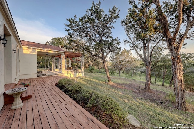 wooden deck with ceiling fan