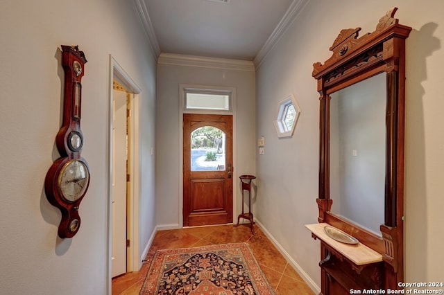 tiled foyer entrance featuring crown molding