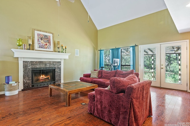 living room featuring high vaulted ceiling, ceiling fan, and wood-type flooring