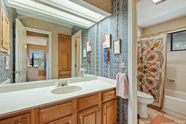 full bathroom featuring vanity, toilet, tile patterned floors, and shower / bathtub combination with curtain