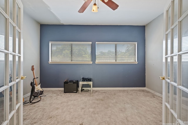 interior space with ceiling fan and french doors