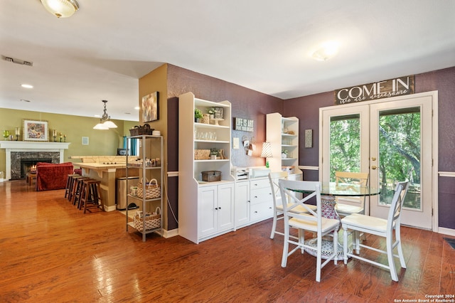 dining space with dark wood-type flooring