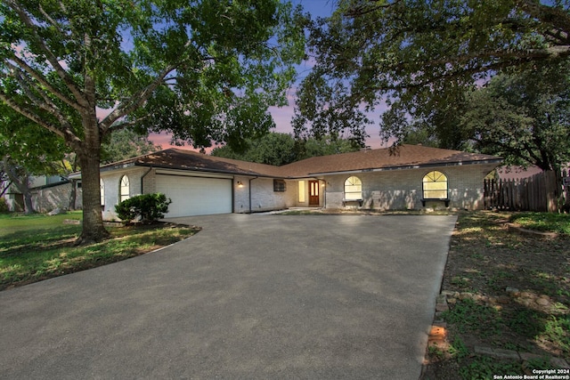 ranch-style house featuring a garage