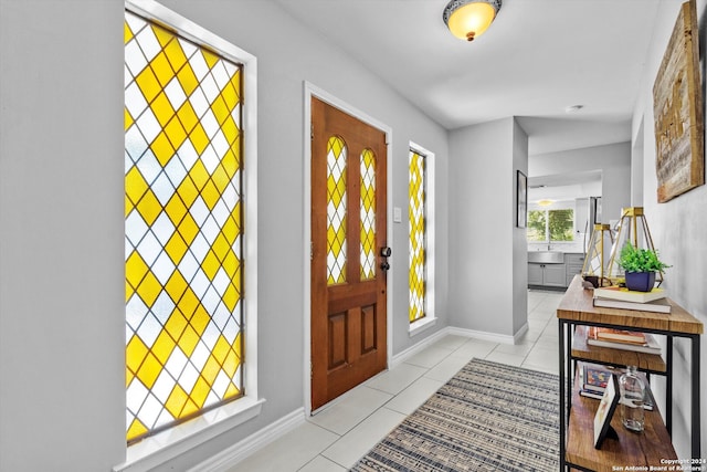 foyer entrance featuring light tile patterned floors