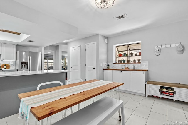 dining room featuring light tile patterned floors