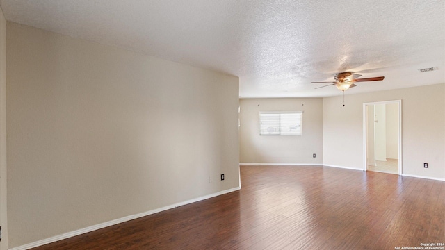 spare room featuring wood-type flooring, a textured ceiling, and ceiling fan