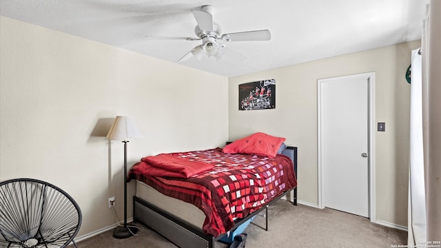 carpeted bedroom with ceiling fan