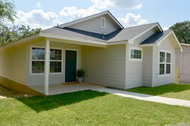 exterior space with a lawn and a patio area