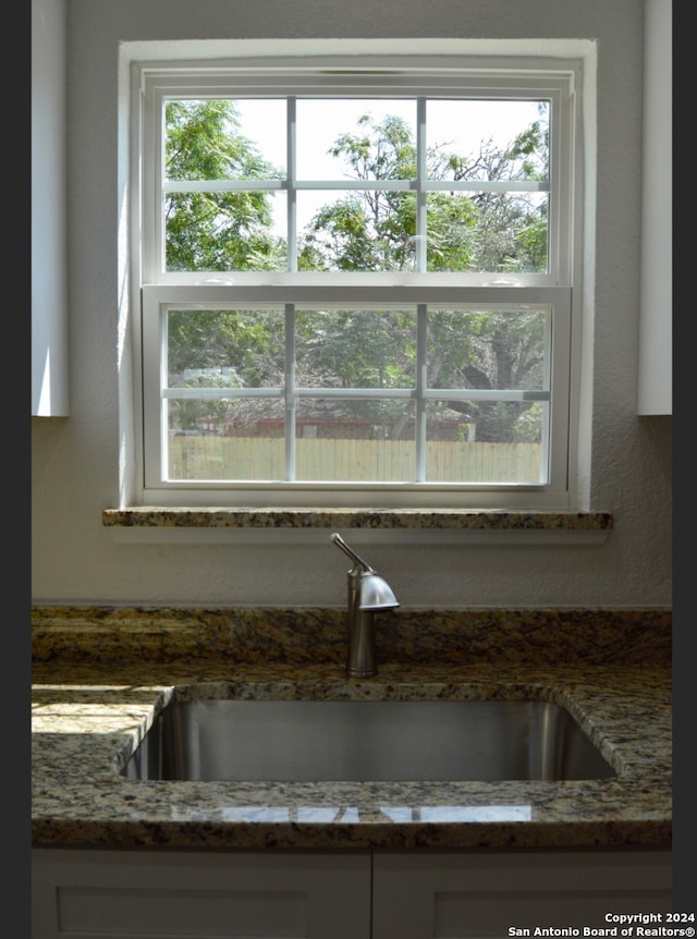 details with dark stone counters and sink