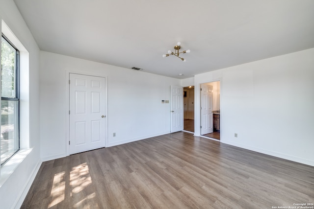 empty room featuring hardwood / wood-style flooring