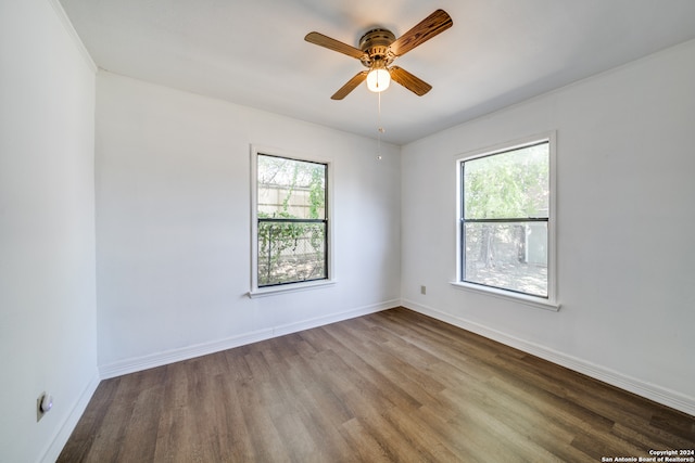 empty room with wood-type flooring and ceiling fan